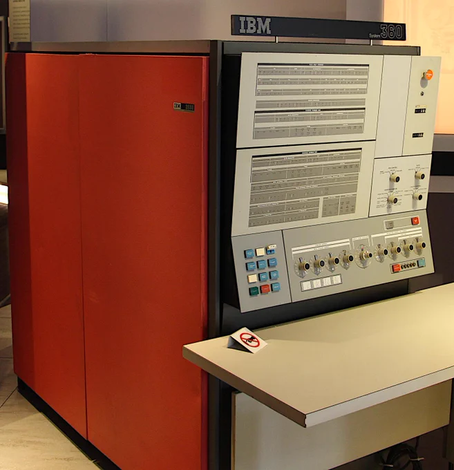 The IBM System/360 Model 30 was in a large red cabinet. It had a complex front panel with lights and knobs.