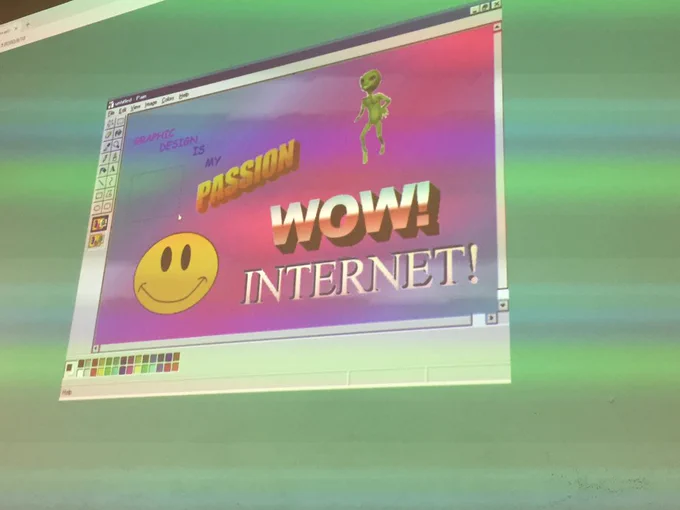 A screenshot of Microsoft paint with a gradient background, an illustration of an alien and smiley face and word art that says “passion” “wow!” “Internet!”.