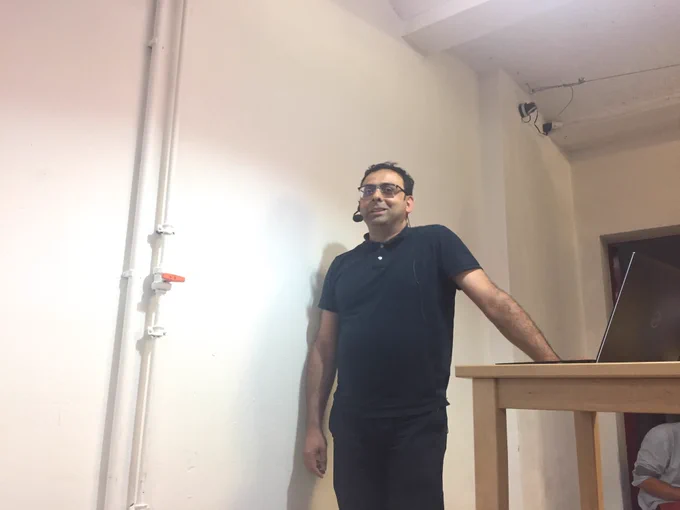 Behrooz speaking to the BerlinJS audience.