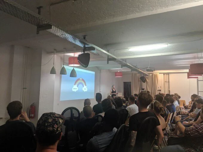 Photo of a room full of lovely web folk listening to Cassie speaking at Berlin.js