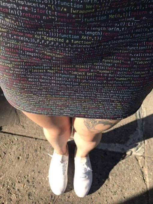 A dress with with JavaScript code printed on it.