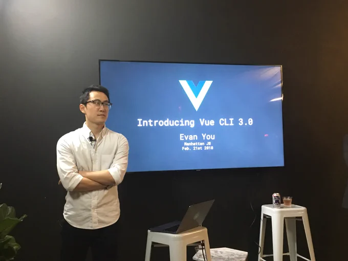 Evan in front of opening slide “Introducing Vue CLI 3.0”