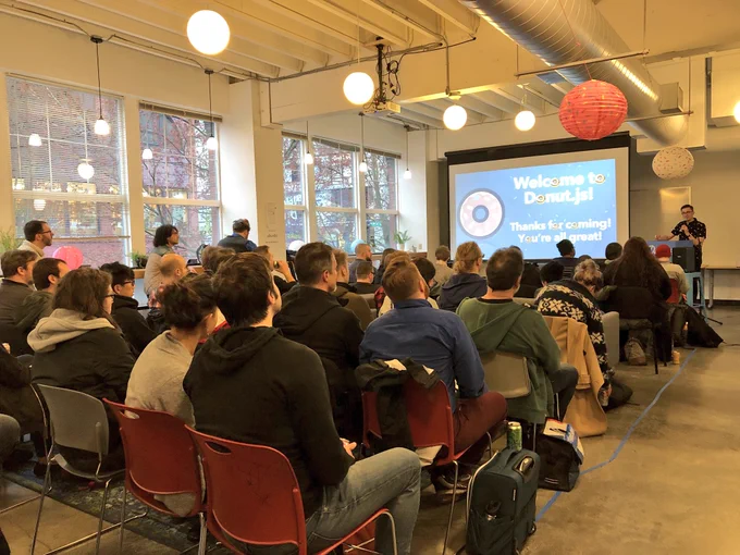 A photo of the audience of Donut.js and @matthewmcvickar doing opening remarks.
