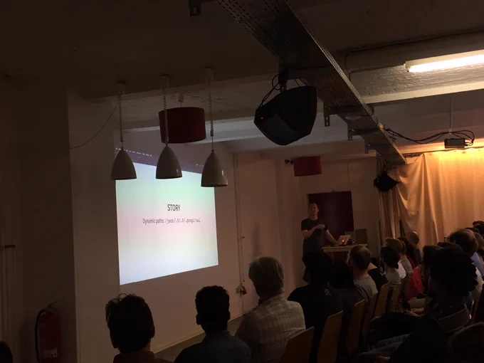A shot from the back with Liam presenting to the crowd.
