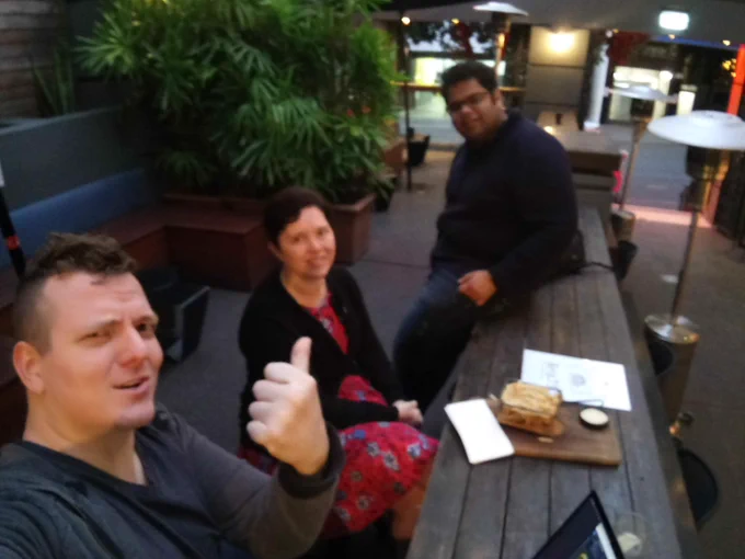 Anna, Ash, and Kartik in a super blurry photo because Ash has a potato for a phone.