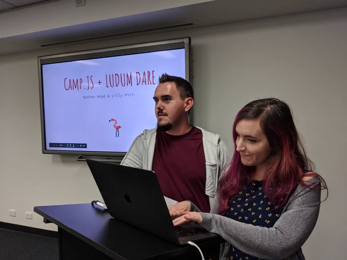 Nathan and Lilly in front of their CampJS + Ludum Dare slide.