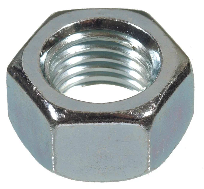 a close-up photo of a hardware nut, hexagonal with a smooth outside and threaded inside