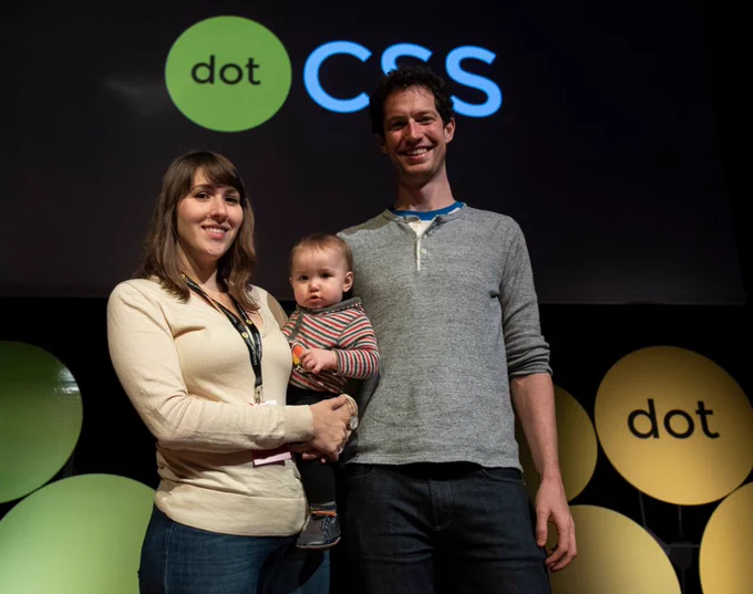 mama, baby, and daddy in front of a dotCSS logo