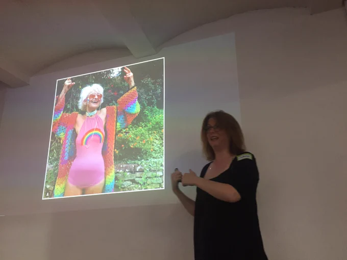 Charlie looking horrified pointing at a grandma in a rainbow bikini.