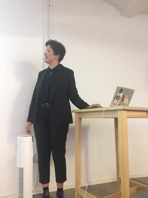 Ira in a suit giving a talk on the QueerJS stage.