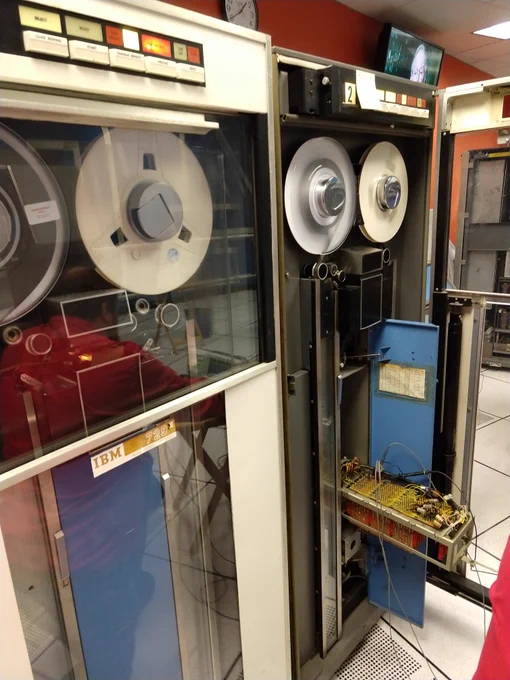 The classic IBM 729 mainframe tape drives are refrigerator-sized units. The one on the right is opened up, exposing some circuit boards.