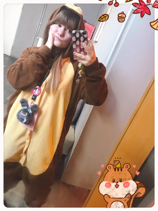 Me in a bear onesie taking a mirror selfie