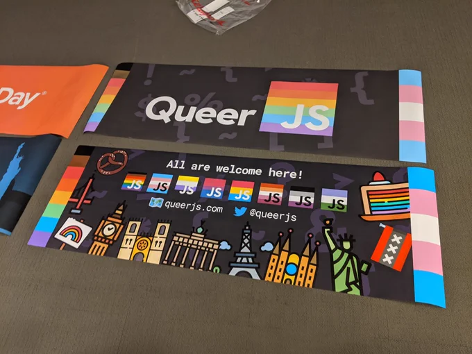 2 large format posters with the queerjs logo 