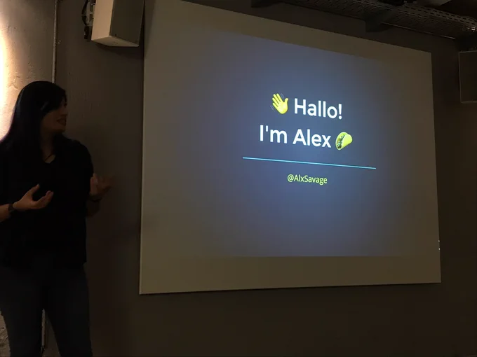 Alex presenting with a slide that says Hallo! I’m Alex with a taco emoji.