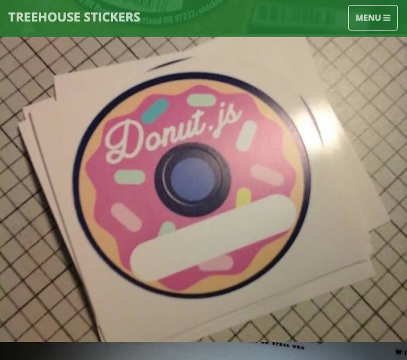 cropped screenshot of the Treehouse Stickers website showing their nav menu and a photo of the Donut.js nametag stickers, which are circular and look like a donut