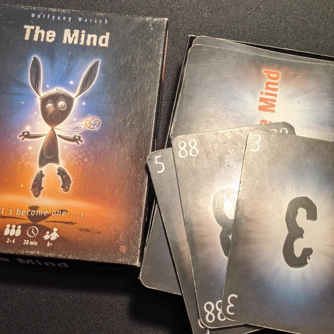 The card game The Mind, with cover art and cards showing