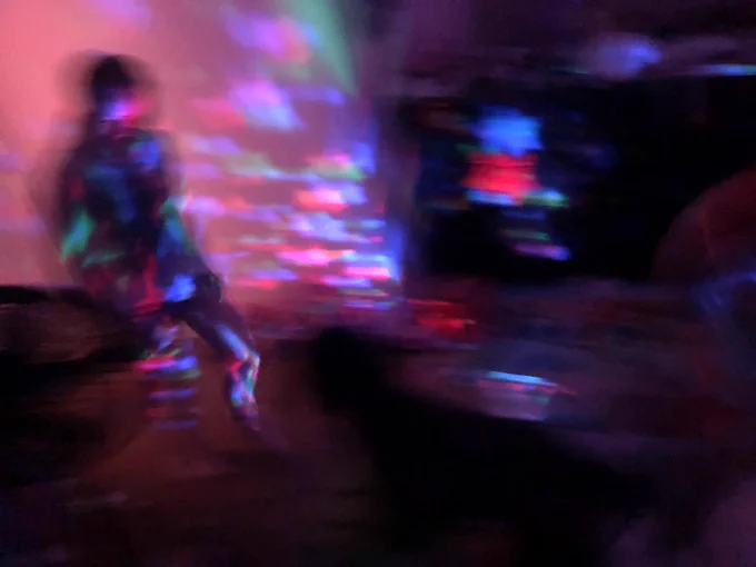 Photo of a girl blurring in a room with stars