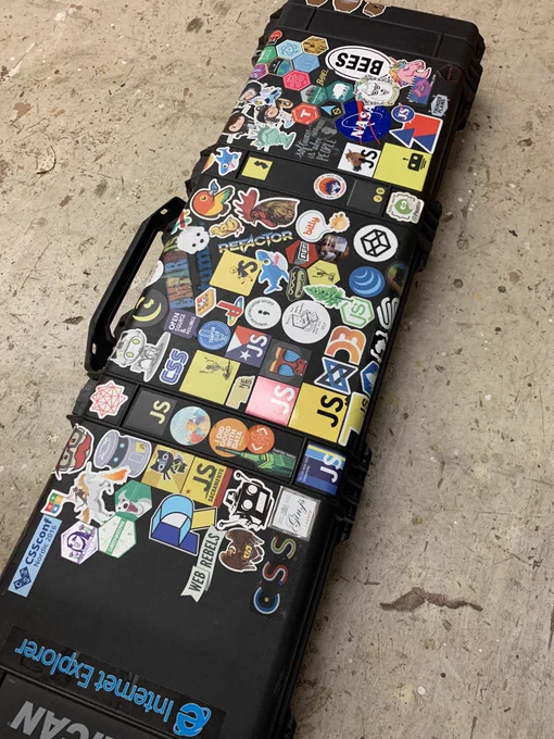 Knitting machine case with lots of stickers.
