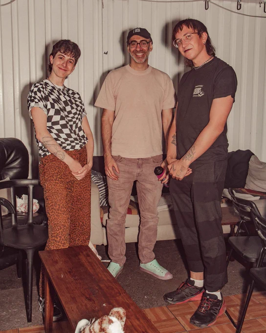 An image of Cassie Tarakajian standing and smiling with 2 of their friends