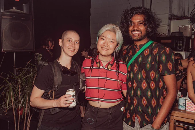 An image of Viola He standing and smiling with 2 of their friends