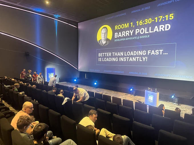 Large cinema screen showing the title of my talk “BETTER THAN LOADING FAST...
IS LOADING INSTANTLY!”