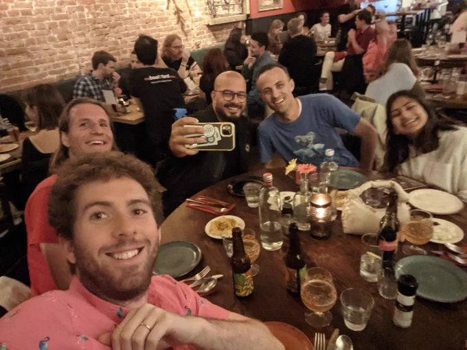 Selfie with Nico, Medhat, Kent, and Anisha at the dinner table; Medhat is taking a selfie with Kent 