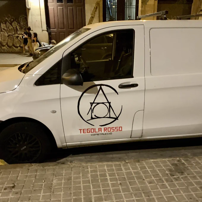 van parked at the street using the same alchemy-related logo postcss uses