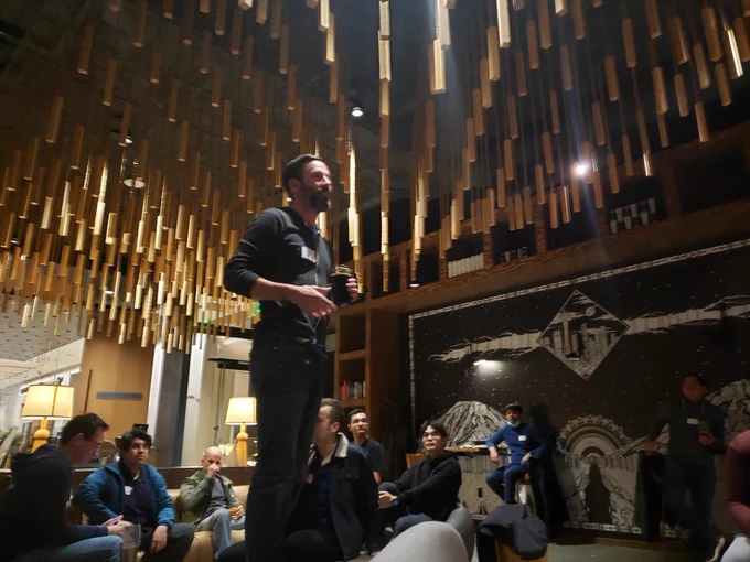 Carter talking in front of a crowd of Seattle JS goers.