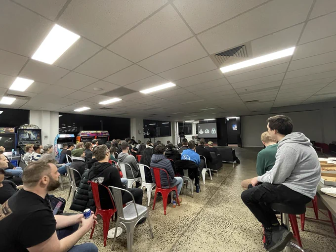 It’s a whole bunch of people at the MelbJS meetup, watching Kitson Kelly talk edge computing and Deno.