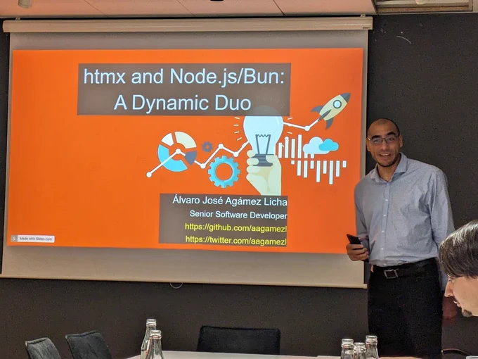 Person in front of a screen that says "htmx and Node.js/Bun: A Dynamic Duo"