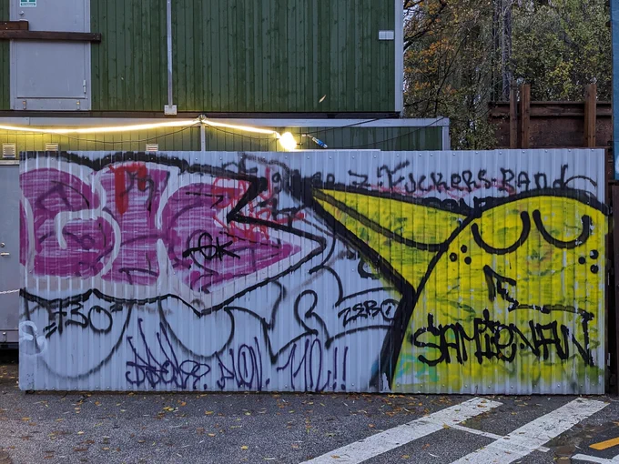 Graffiti on a white wall.