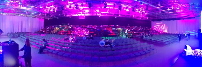 Panoramic shot of the mostly-empty-for-now audience seats and bleachers.
