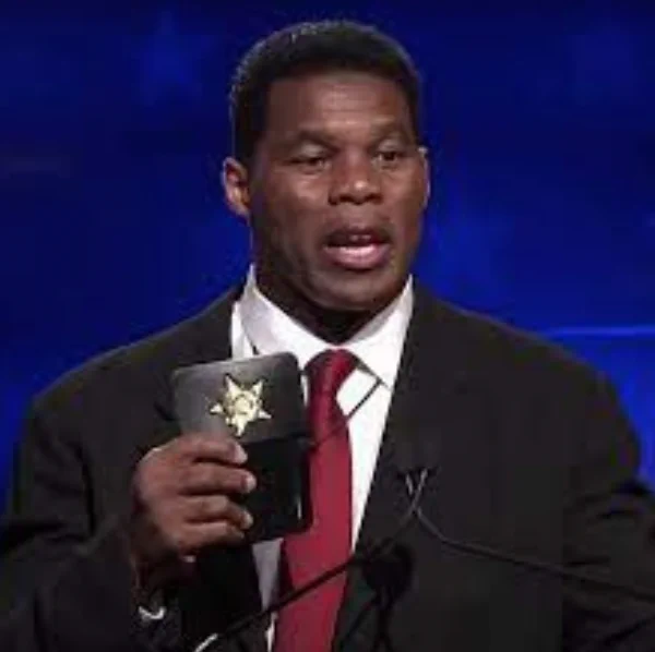 Herschel Walker holding up a fake badge pretending to be legit