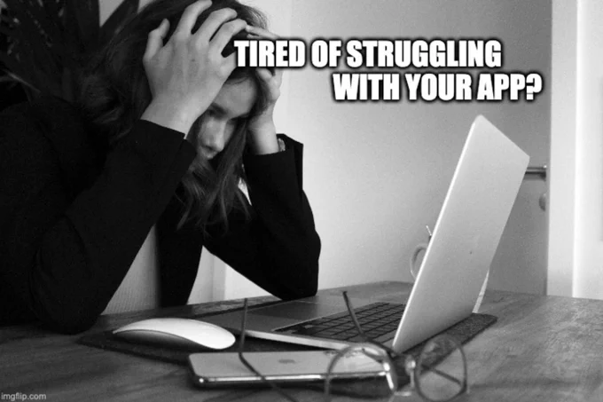Black and white image. Female programmer sits at a desk with hands on her head, staring in frustration at her laptop. Meme made with imgflip