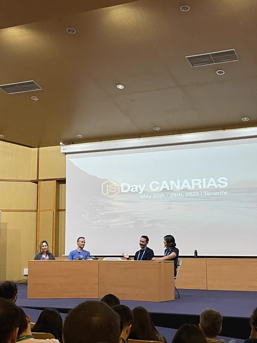 Four speakers sitting at a round table at the JSDayCanarias conference.