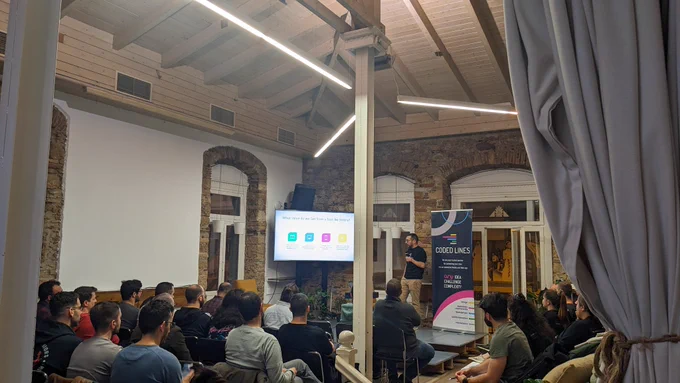 Tasos Maroudas, Technical Director at Coded Lines, talking about "How to Bugproof and Stabilize your Mobile App after Launching in Production" on the stage of GreeceJS meetup.