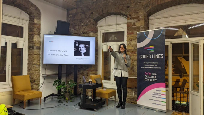 Marianna Androutsopoulou, Software Engineer in Test @ Causaly on our stage presenting "Cypress vs. Playwright: The battle of Testing Titans".