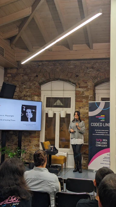 Marianna Androutsopoulou, Software Engineer in Test @ Causaly on our stage presenting "Cypress vs. Playwright: The battle of Testing Titans".