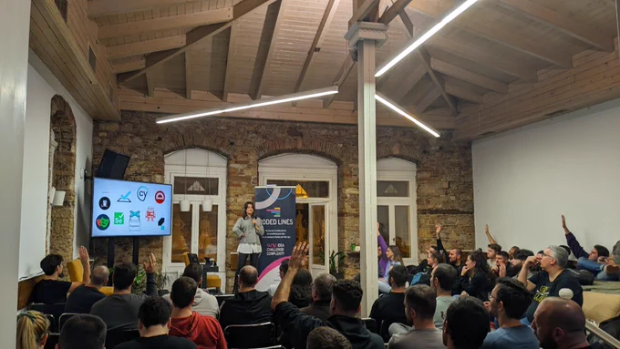 Marianna Androutsopoulou, Software Engineer in Test @ Causaly on our stage presenting "Cypress vs. Playwright: The battle of Testing Titans".
