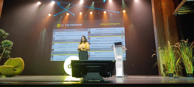 Nessrine Berrama, dotJS CEO, on stage in front of dotJS program