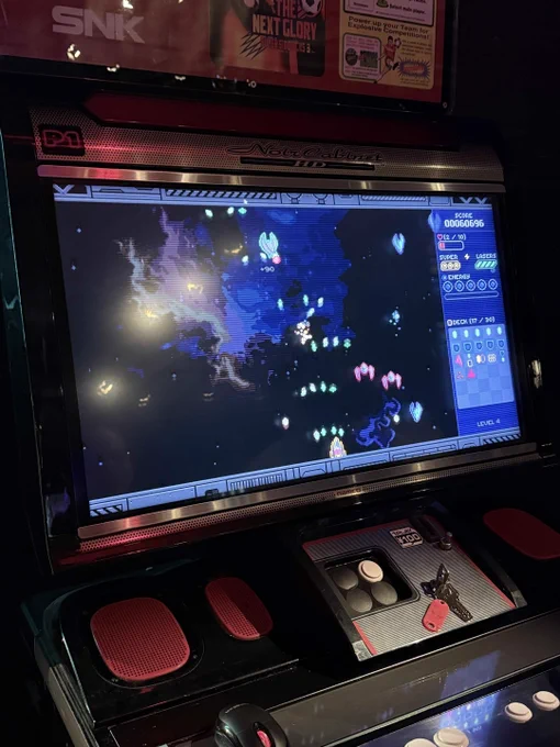Closeup of SpeceDeck X, a shoot-em-up deckbuilding game, running on arcade machine
