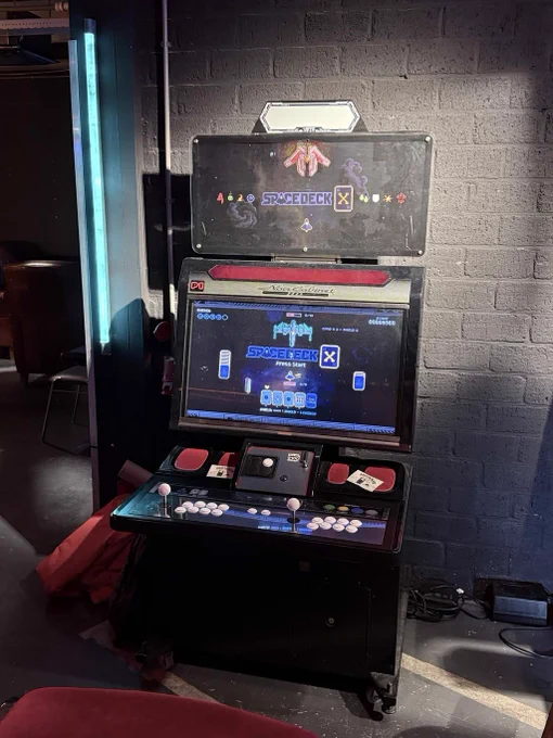 SpaceDeck X, a shoot-em-up deckbuilding game, running on arcade machine